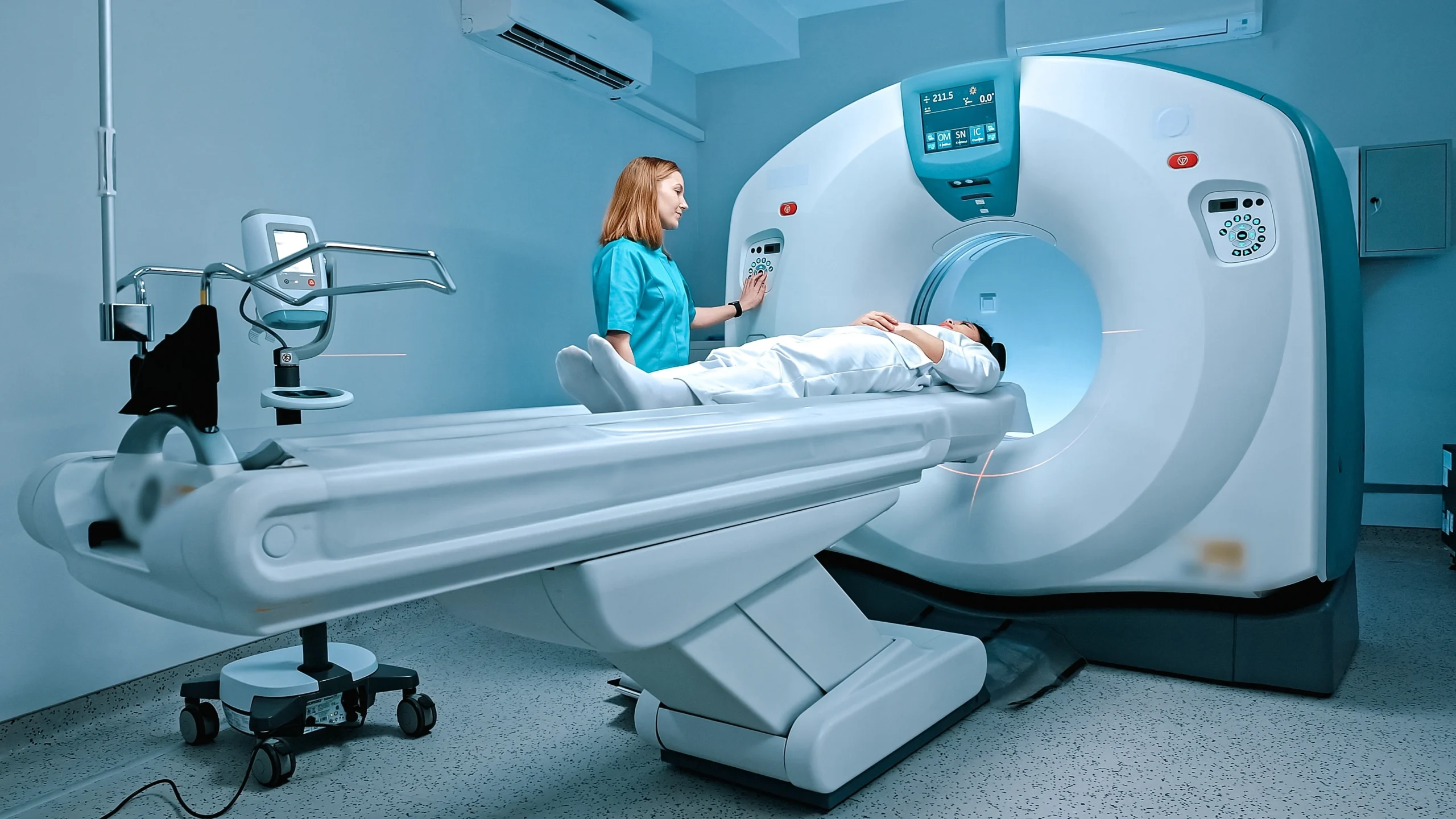 A health professional puts a patient into an MRI machine