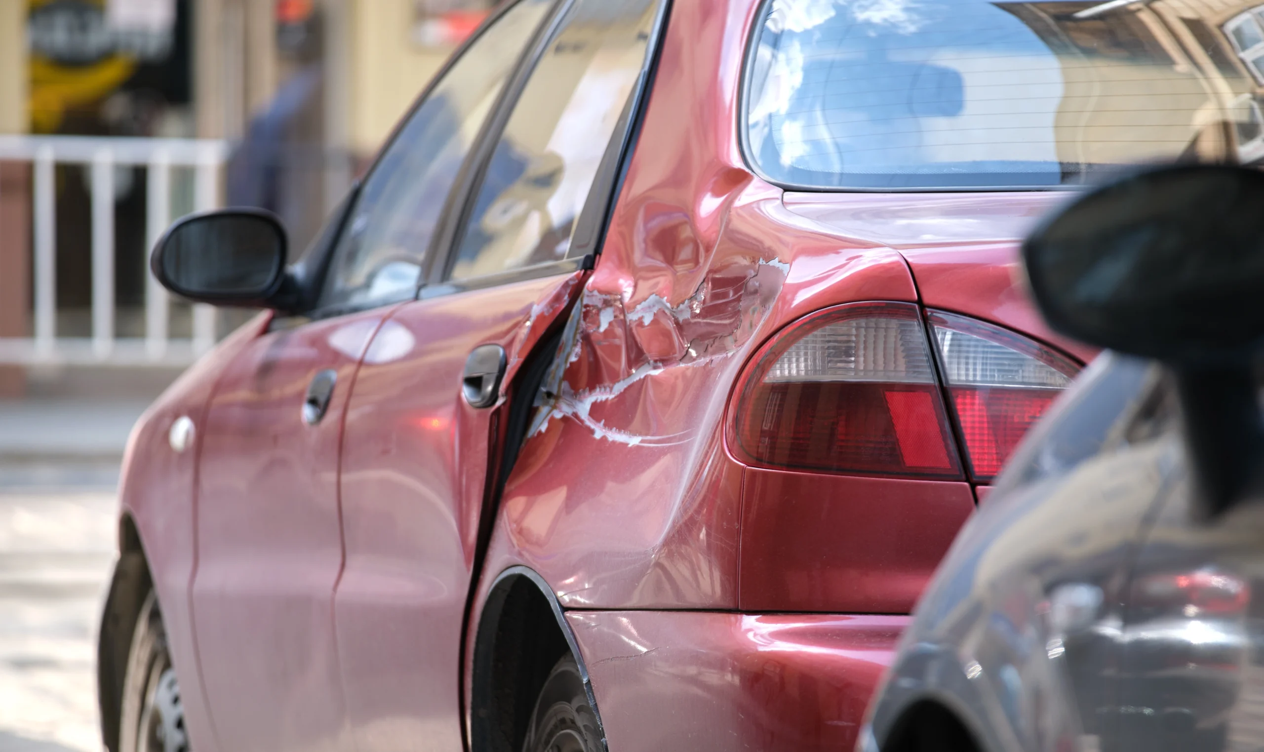 A car's side is damaged from an accident
