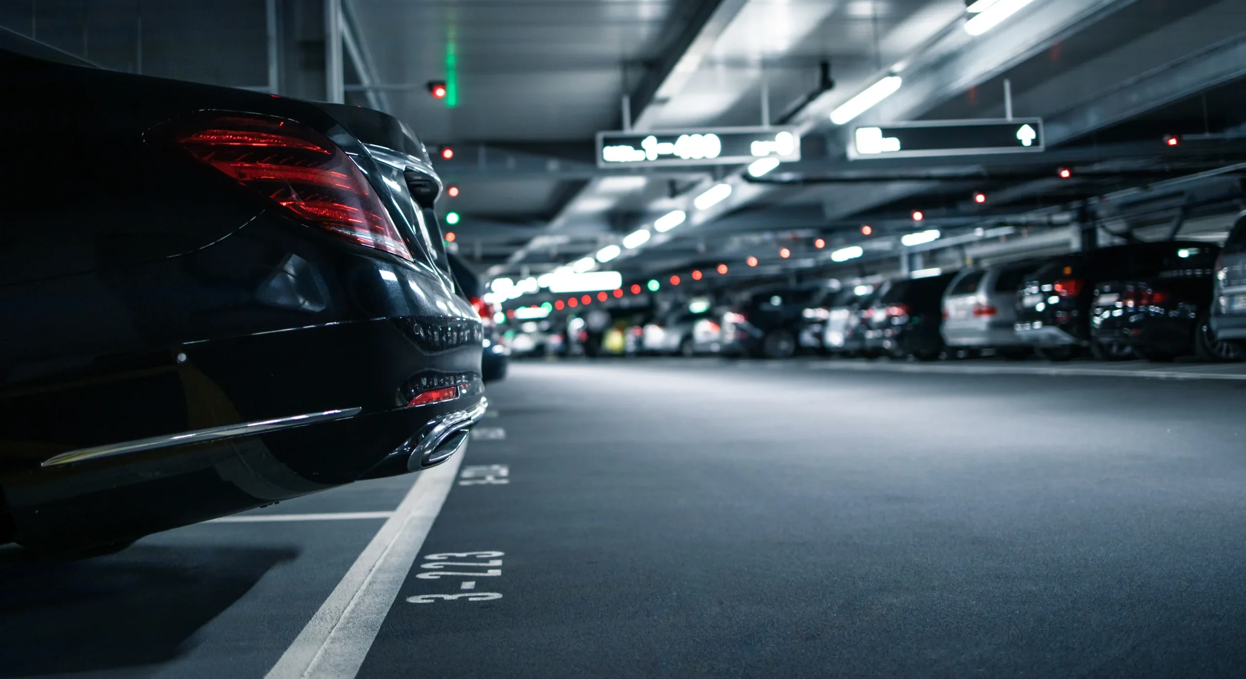 A car is parked in a parking garage